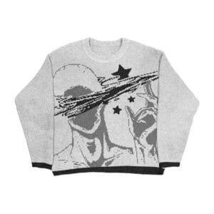 Pull graphique gris avec figure abstraite et étoiles noires, style contemporain et artistique.