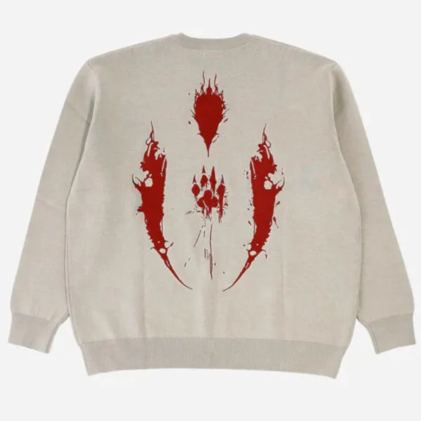 Sweatshirt Beige Avec Design Graphique Rouge Audacieux Pour Un Style Moderne Et Décontracté.